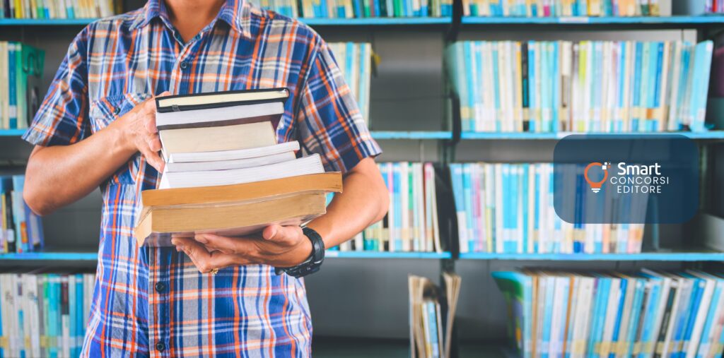 man-student-working-library_logo Come scegliere il manuale giusto per un concorso pubblico